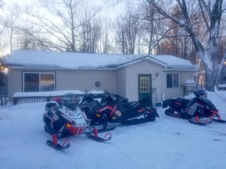 Snowmobiles Parked at Cottage #2